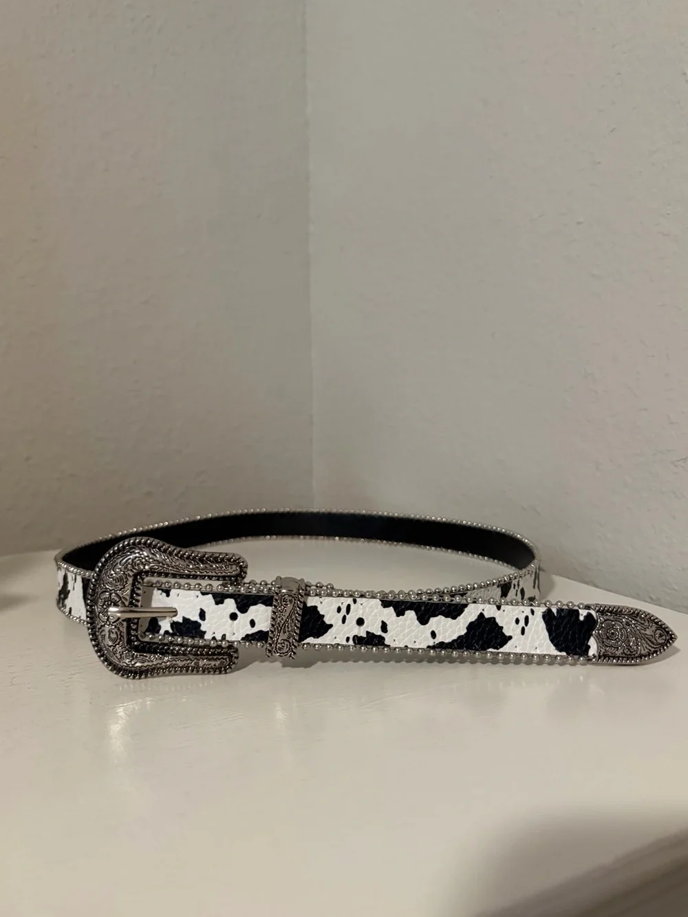 Western-Style Black and White Cow Print Belt with Silver Buckle